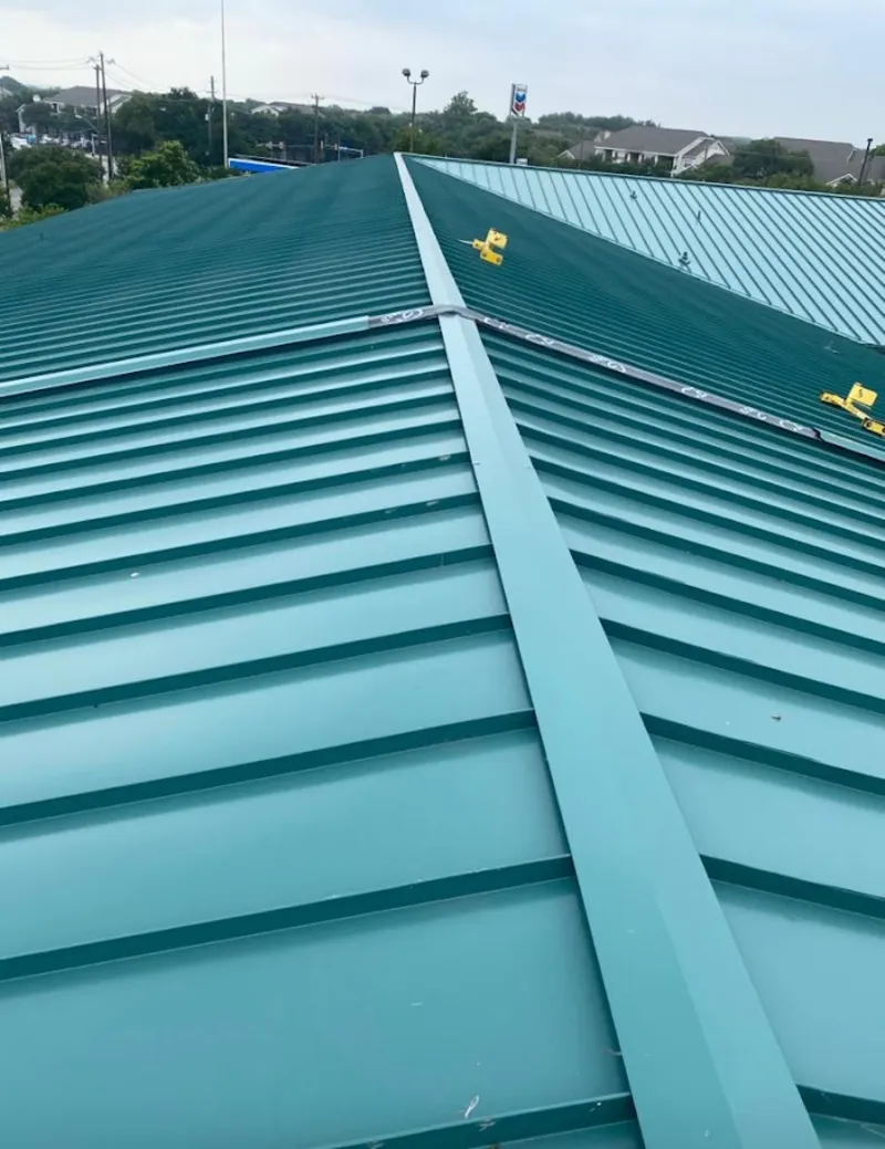 Green commercial metal roof ridge and valley for Metal Roof Repair in The Village