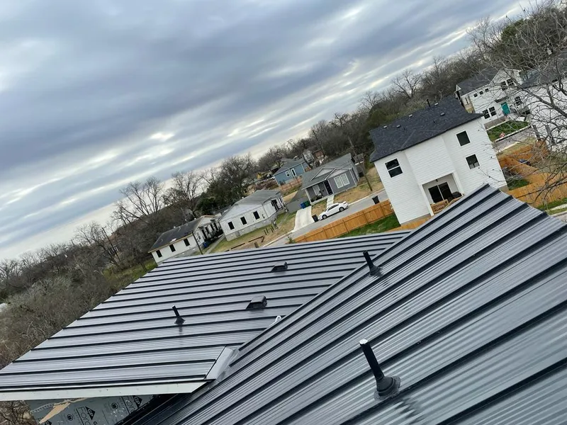 Standing seam metal roof panels with vents for Skylight Repair in The Village